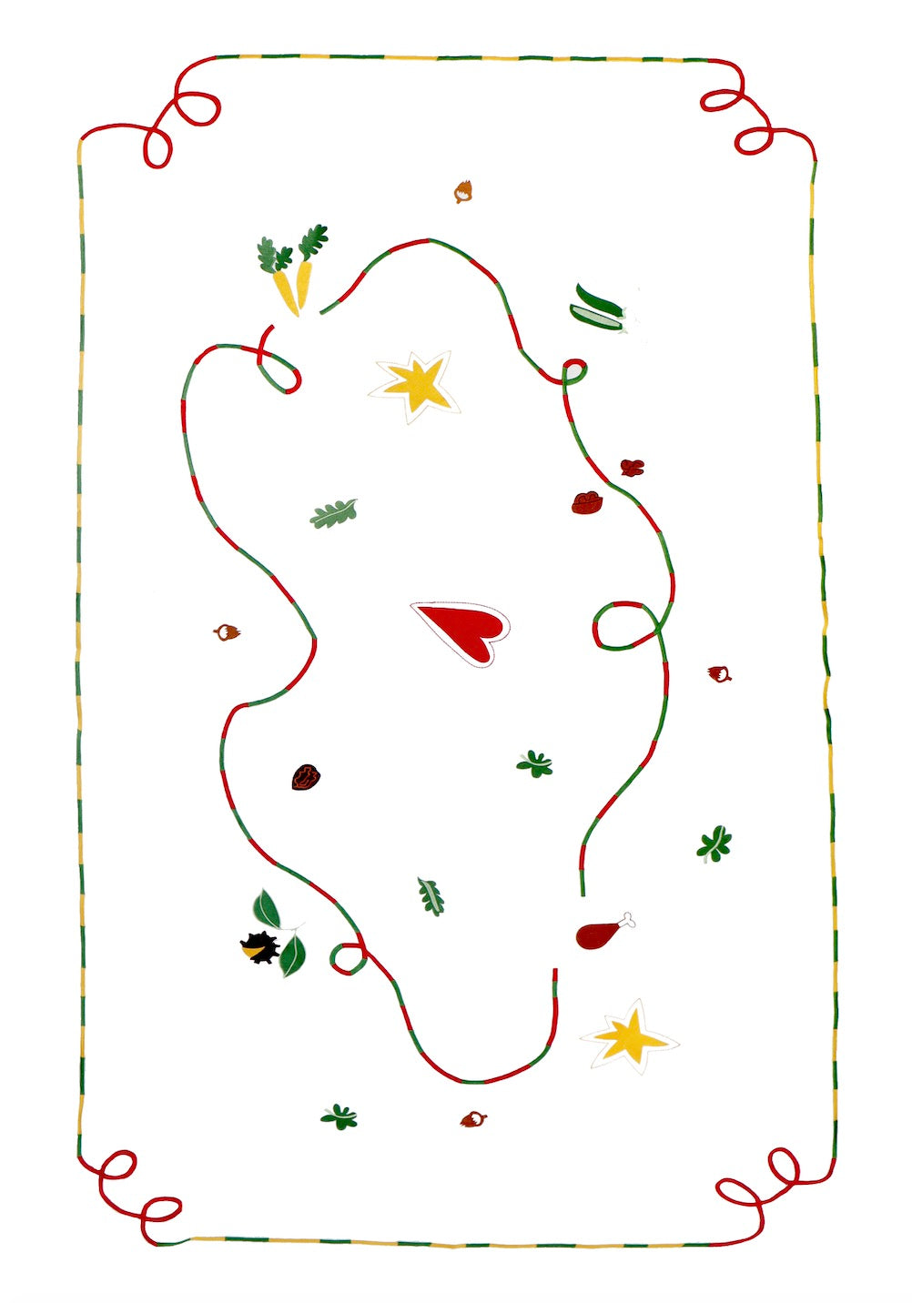 The white tablecloth has Christmas themed items embroidered on it: red heart, green leaves, green beans, carrots, chesnuts, chicken/turkey drumstick, a bright star and a red and green swirl covering the entire middle section.