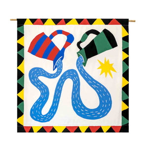 The flag background is white, and has a black, red, and yellow and green border. The design shows two water jugs (one red and blue, the other black and green) flowing water to each other. There is a yellow star on the right side.  