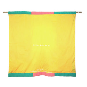 The back of the flag is yellow, and has the flag and creators names embroidered in white.